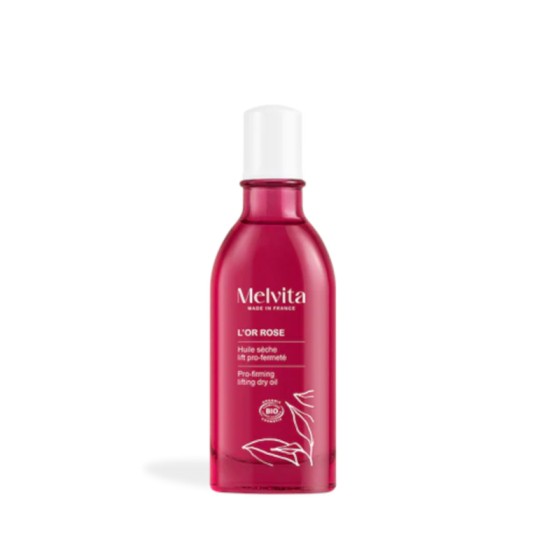 A 100ml bottle of Melvita L'or Rose Pro Firming Lifting Dry Oil, featuring a vibrant pink glass design with a white cap and white floral illustrations on the front.