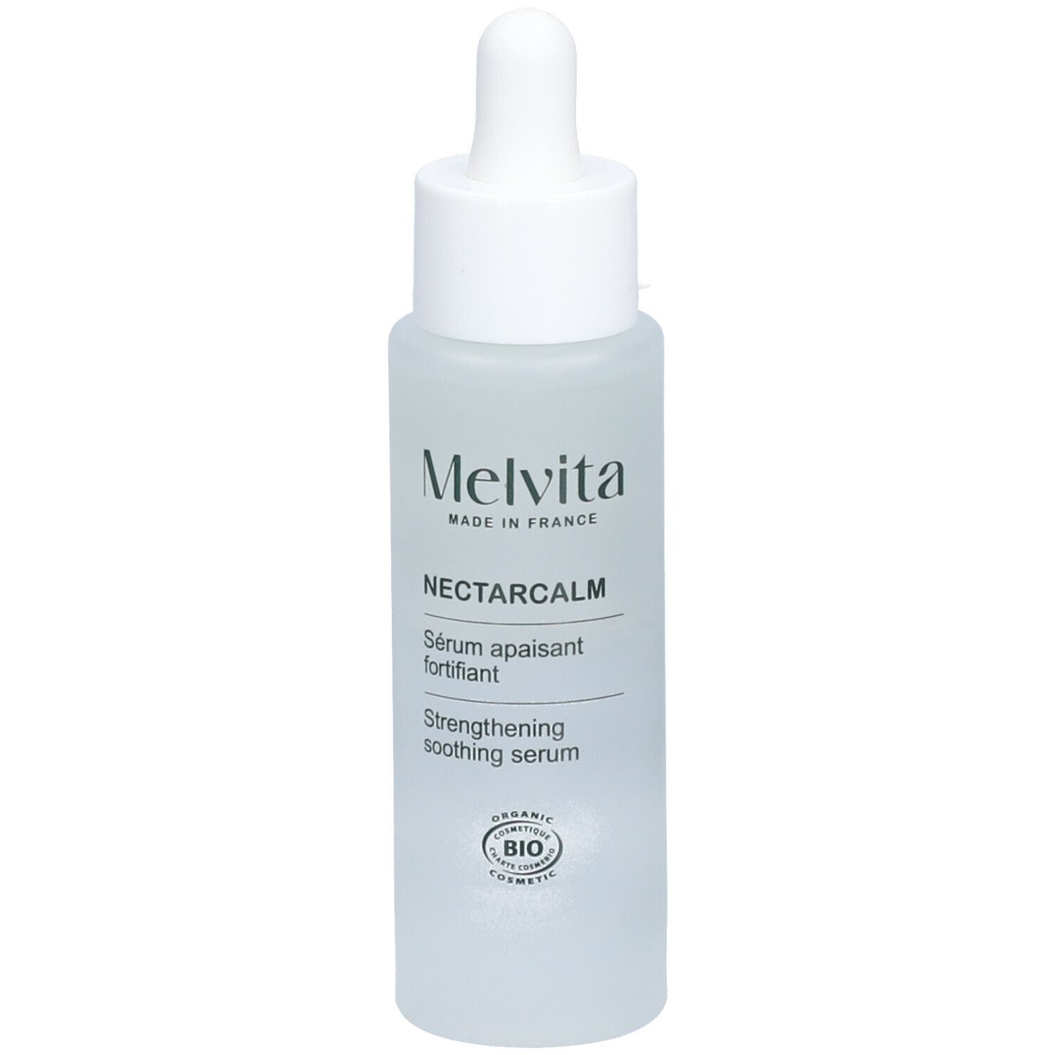 Clear glass bottle with a white dropper cap, labeled "Melvita NectarCalm Strengthening Soothing Serum 30ml," featuring a minimalist design and a frosted finish.