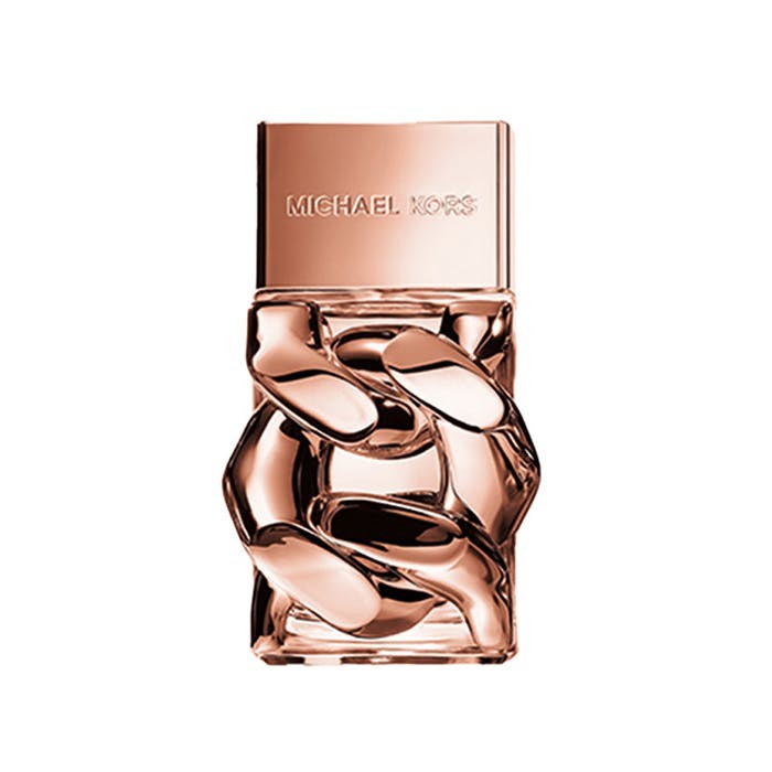 Clear glass bottle of MICHAEL Michael Kors Amber Fruity Floral Spray Eau De Parfum, featuring a rose gold cap and a sculptural design with interlocking shapes.