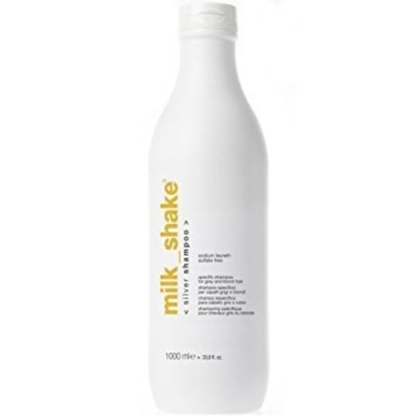 White plastic bottle of "milk_shake Silver Shine Shampoo," 1000 ml, featuring a minimalist design with yellow text and a flip-top cap.