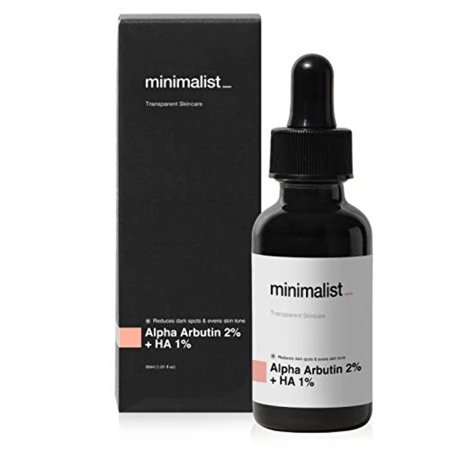 Clear glass dropper bottle with a black lid, labeled "Minimalist Alpha Arbutin 02% Face Serum," alongside a sleek black box featuring minimalist design elements.