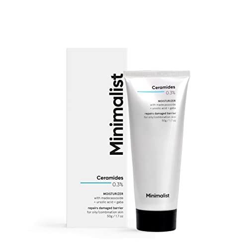 White tube with silver cap labeled "Minimalist Ceramides 0.3% + Madecassoside Barrier Repair Moisturiser" alongside a sleek white box, both featuring minimalist design elements.