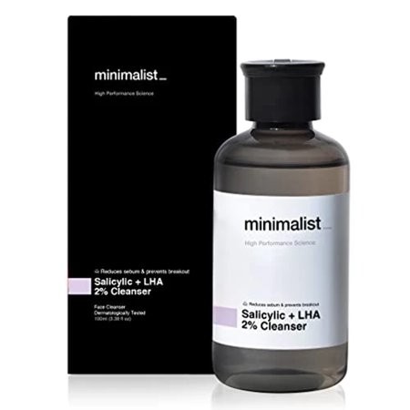 Clear bottle of Minimalist Salicylic Acid + LHA 2% Cleanser, 100ml, with a black label featuring white text, set against a sleek black box.