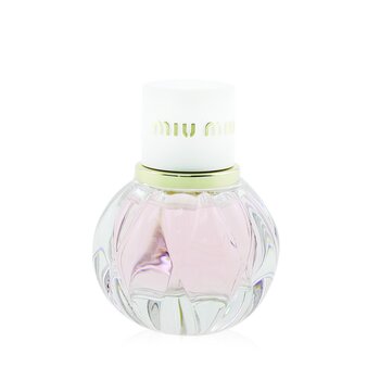 Clear glass bottle with a rounded base, featuring a pink liquid inside, topped with a white cap and gold lettering that reads "Miu Miu."