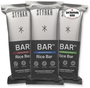 Three Styrkr BAR50 Energy Bars in assorted flavors, featuring dark chocolate chip, dates with almond and sea salt, and cinnamon with caramel, all in sleek, colorful packaging.