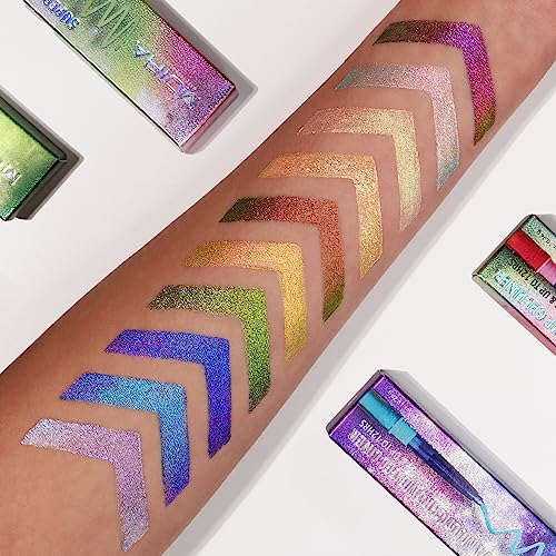 Swatches of Moira Supernova Multichrome Gel Liner in vibrant hues of green, gold, purple, and blue, applied in chevron patterns on a forearm, with colorful packaging nearby.