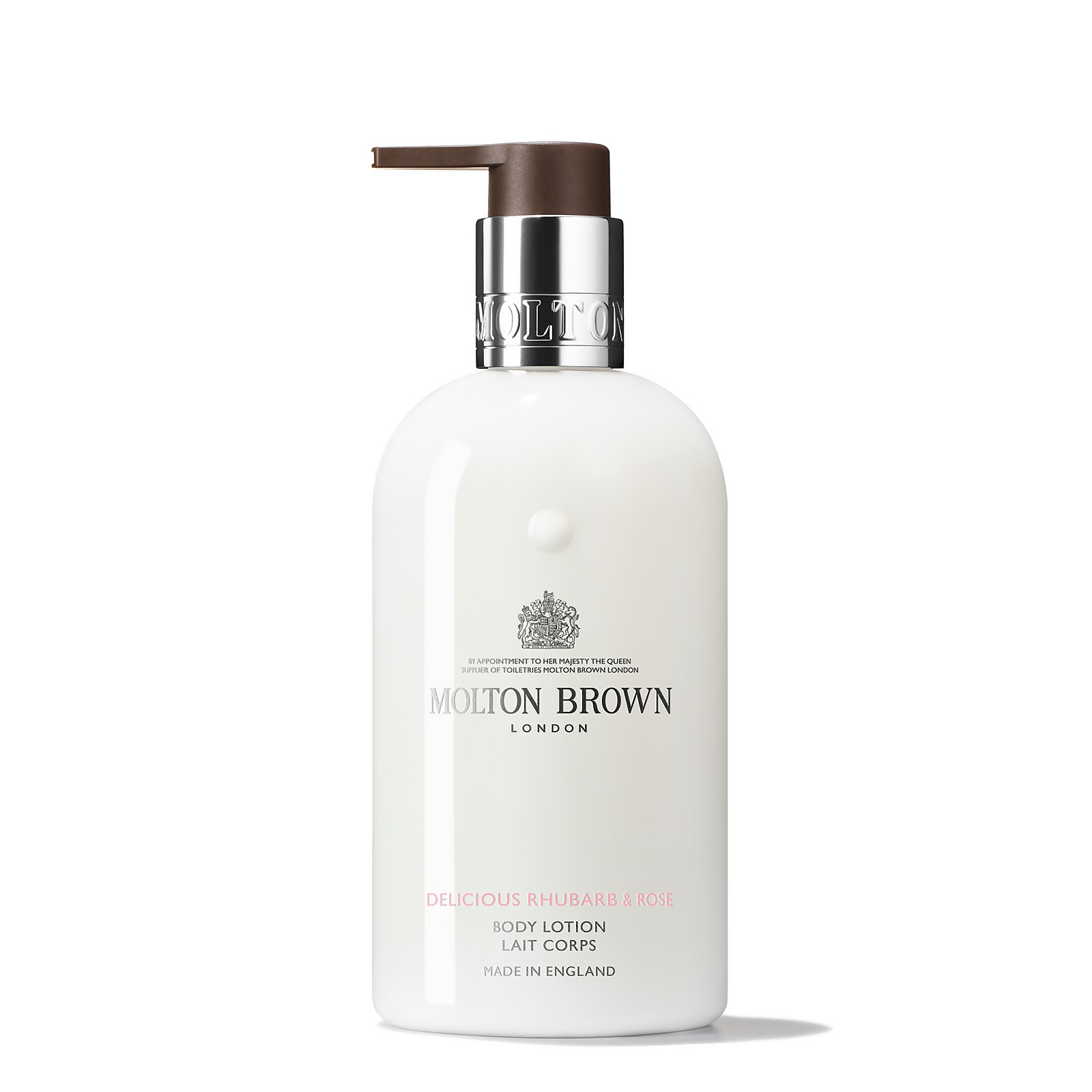 White bottle of "Delicious Rhubarb and Rose Body Lotion" by MOLTON BROWN, featuring a brown pump top and elegant silver branding, labeled as made in England.