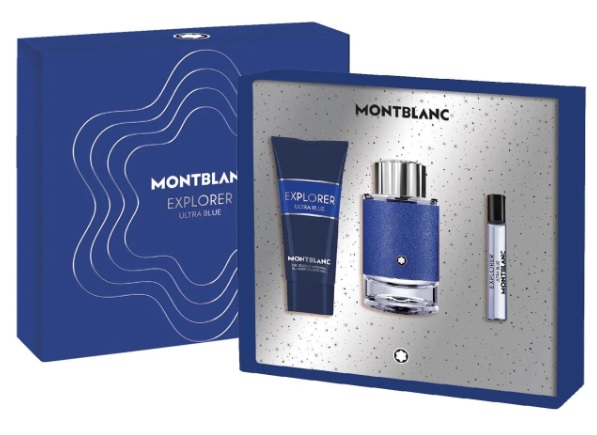 Montblanc Explorer Ultra Blue 3-piece set featuring a blue box, a 100ml EDP bottle, a 7.5ml travel spray, and a 100ml all-over shower gel, all with sleek, modern designs.