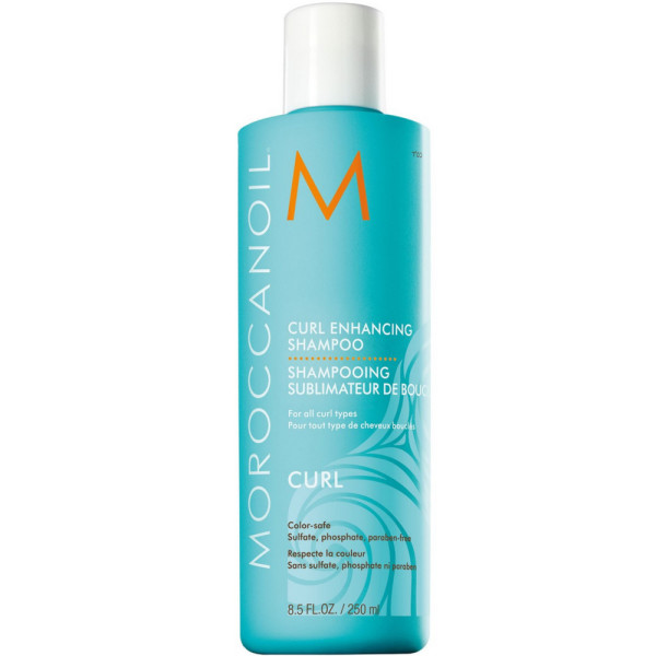 Turquoise bottle of Moroccanoil Curl Enhancing Shampoo, featuring a white M logo, with a sleek design and a label indicating it's 8.5 fl. oz., suitable for all curl types.