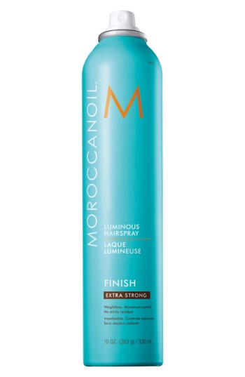 A turquoise aerosol can of Moroccanoil Luminous Hairspray Extra Strong, featuring a sleek design with a prominent white "M" logo and labeled for maximum hold and shine.