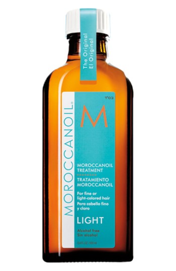 Amber glass bottle with a white and orange label, featuring the Moroccanoil logo and "Light" treatment for fine or light-colored hair, alcohol-free formula, 100 ml size.