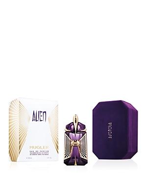 Purple bottle with a gold cap, resembling a jewel, alongside a luxurious gold and purple box labeled "ALIEN" by Mugler, showcasing the 60ml refillable Eau De Parfum.