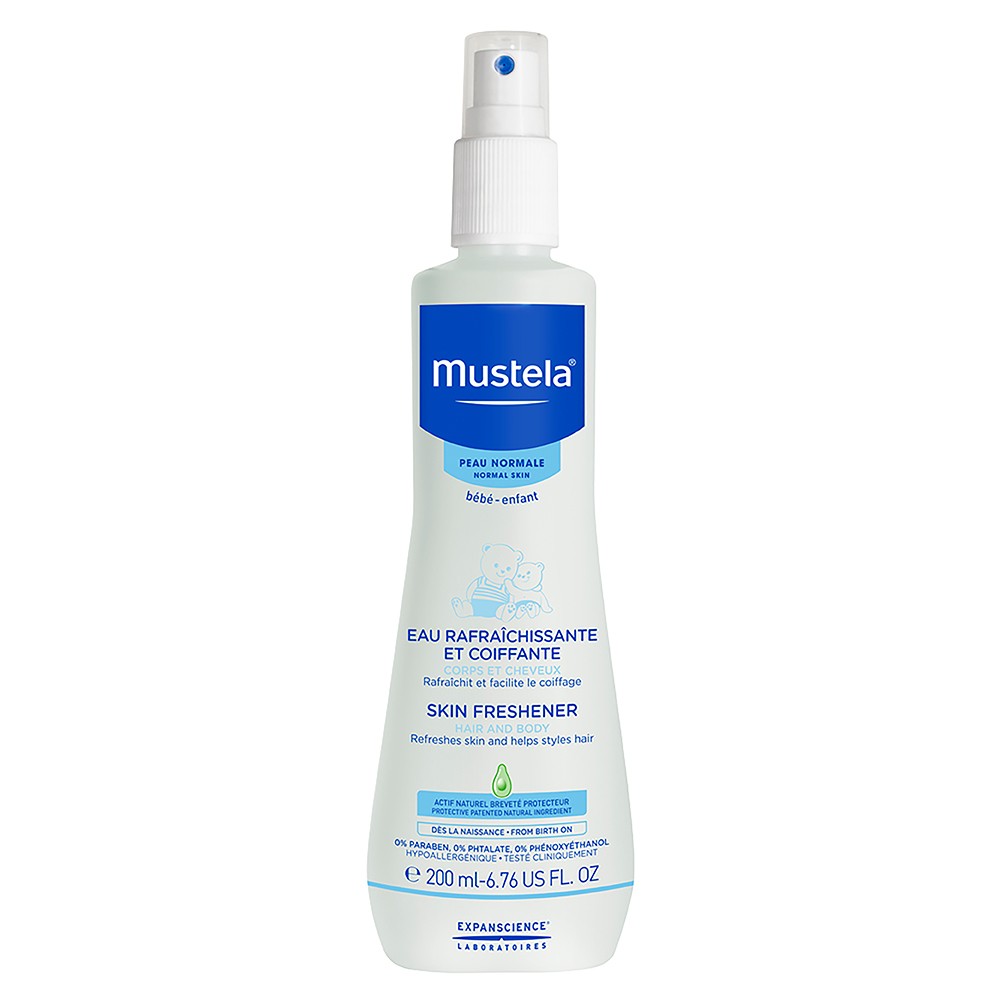 White plastic spray bottle with a light blue label, featuring the Mustela logo and product details, containing 200 ml of hair and body freshener for normal skin.