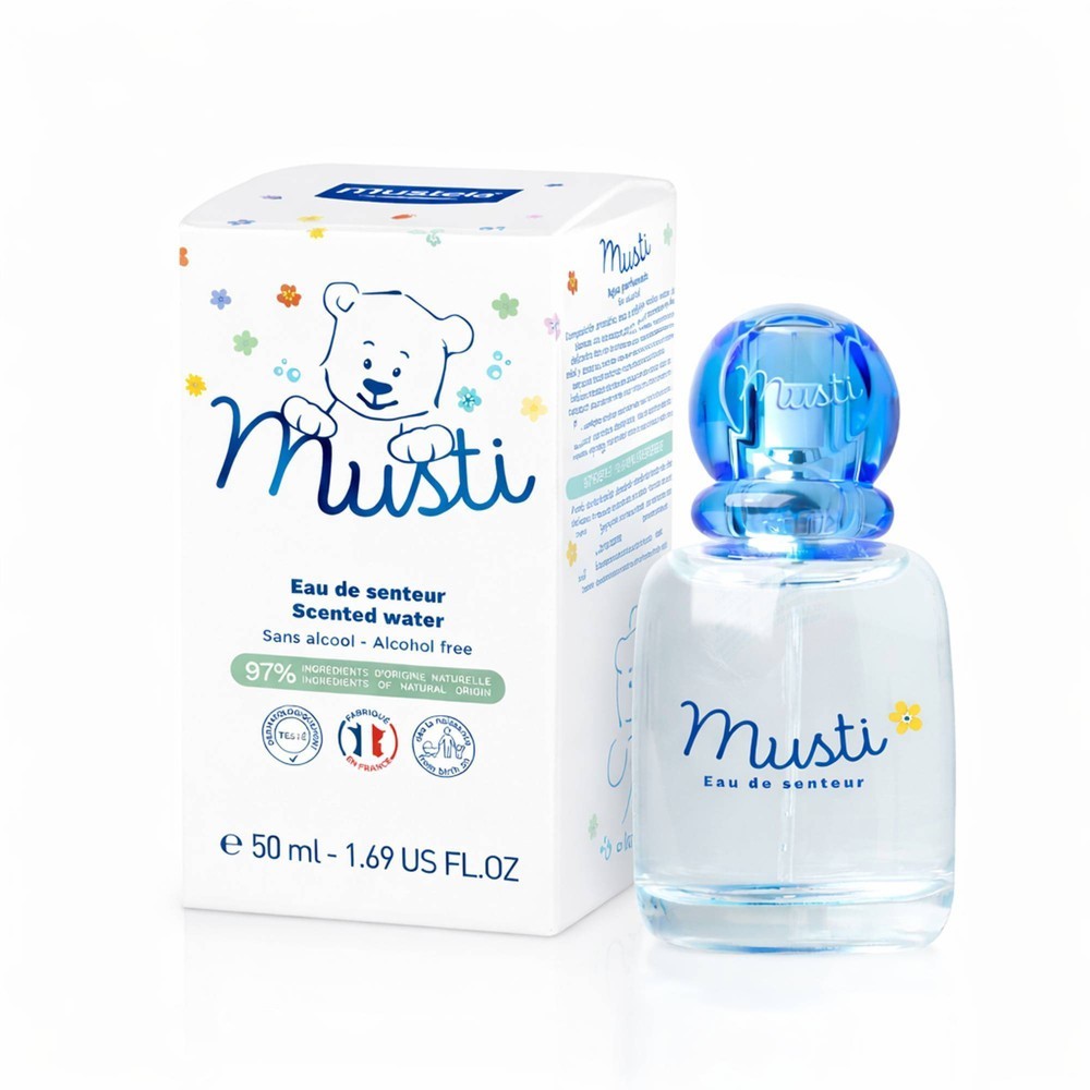 Clear glass bottle with a blue round cap, featuring a cartoon bear design; accompanied by a white box with colorful floral accents, labeled "Musti Eau De Senteur."