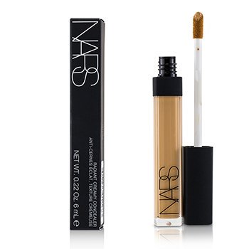 NARS Radiant Creamy Concealer in a clear tube with a black cap, featuring a doe-foot applicator, alongside a sleek black box with white lettering.