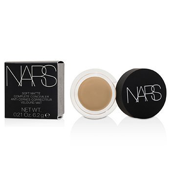 NARS Soft Matte Complete Concealer in a small round jar with a black lid, featuring a beige creamy product inside and a sleek black box with white branding.
