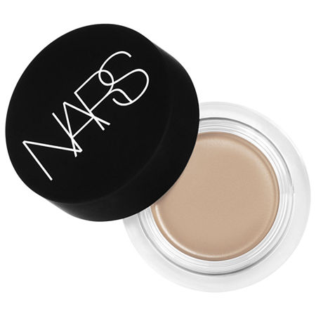 Soft Matte Complete Concealer by NARS in a clear jar with a black lid, featuring a creamy beige product inside, designed for a smooth, matte finish.