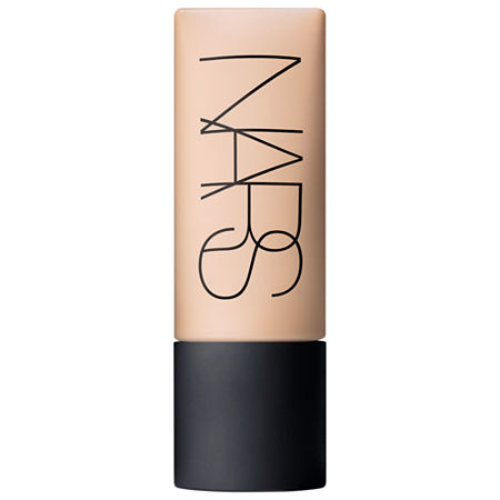 Nars Soft Matte Complete Foundation in Yukon features a sleek, cylindrical bottle with a nude beige shade and a matte black cap, showcasing the brand's signature logo in bold lettering.