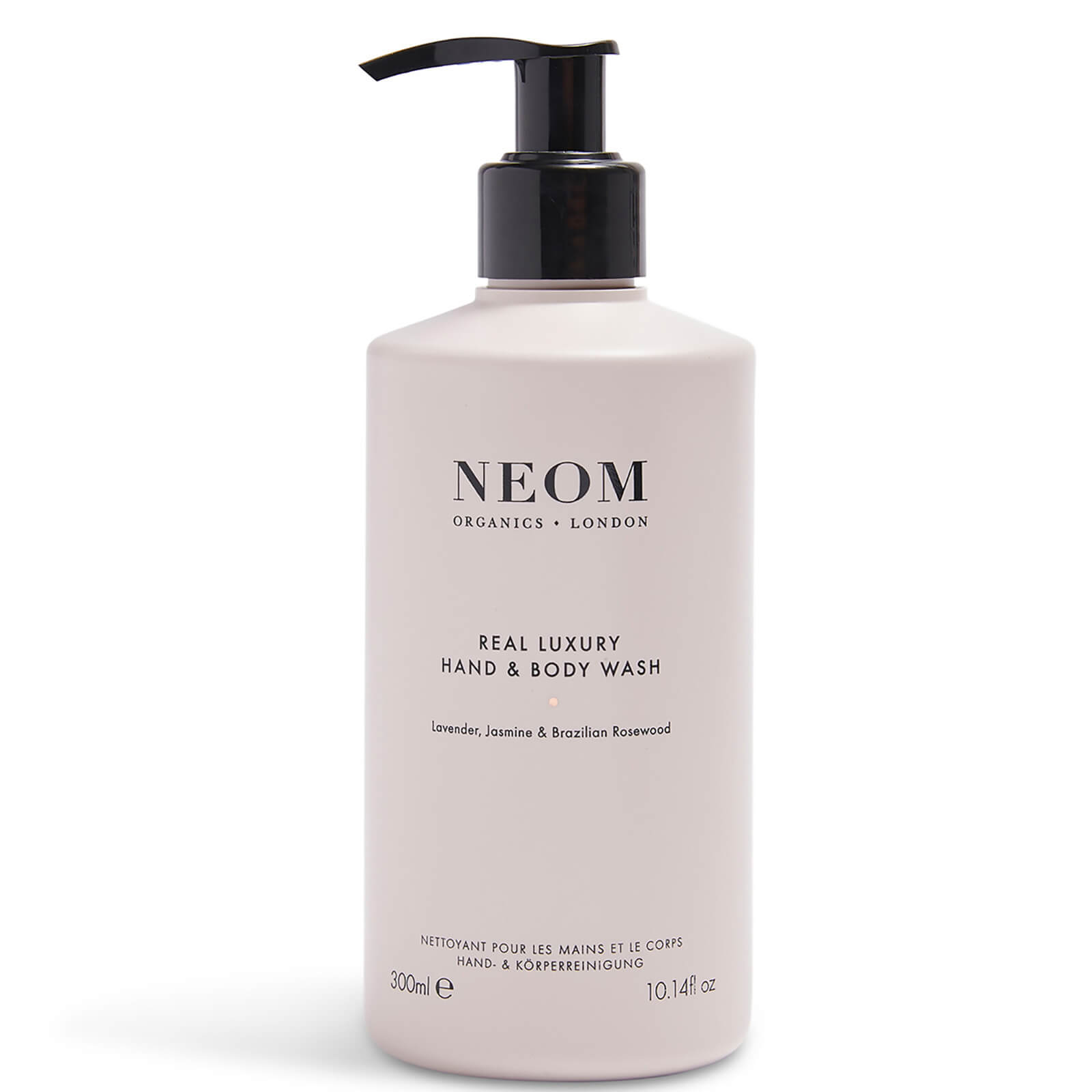 Light pink bottle with a black pump, labeled "NEOM Real Luxury Hand & Body Wash," featuring lavender, jasmine, and Brazilian rosewood scents, 10 fl. oz. capacity.