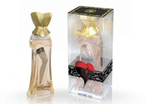 Clear glass bottle shaped like a woman's silhouette, adorned with a golden corset top and a decorative black lace band, alongside a stylish box featuring a heart design.