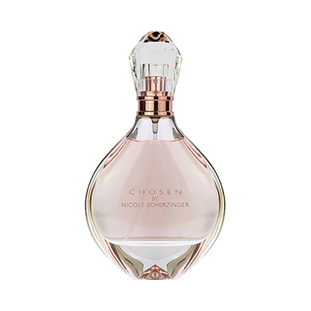 Elegant glass bottle of "Chosen" EDP by Nicole Scherzinger, featuring a crystal-like cap, soft pink liquid, and embossed text on the front.