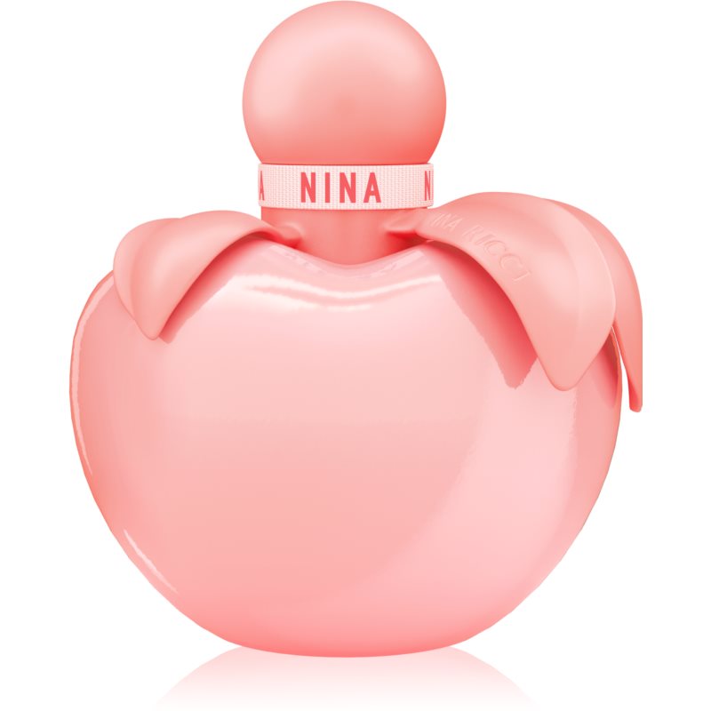 A glossy pink apple-shaped bottle with a round cap, featuring a light pink ribbon labeled "NINA" around the neck, containing 2.7 oz of Nina Rose EDT for women.