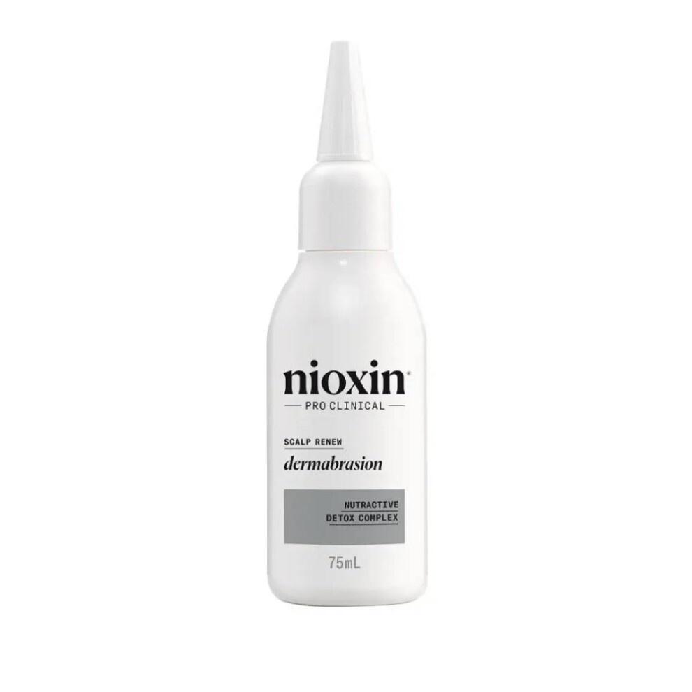White plastic bottle with a pointed applicator top, labeled "Nioxin Pro Clinical Scalp Renew Dermabrasion," featuring a gray accent and 75ml capacity.