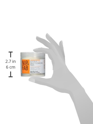 NIP+FAB Overnight Skin Glow Duo features a clear jar with an orange and white label, showcasing "Glycolic Daily Cleansing Pads," held in a hand for scale.