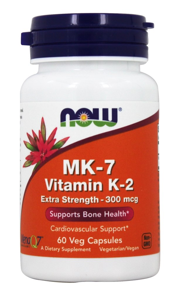 White bottle with a blue cap labeled "NOW" and "MK-7 Vitamin K-2," featuring a pink flower graphic, contains 60 vegetarian capsules, highlighting cardiovascular and bone health support.