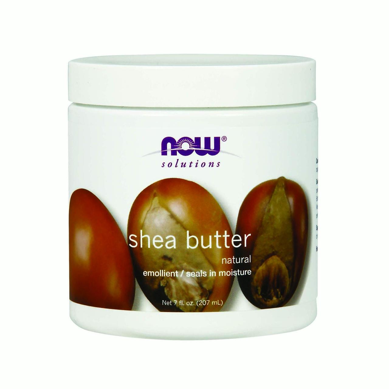 White container of Now Foods Shea Butter, 7 oz, featuring a label with brown shea nuts and text highlighting its natural moisturizing properties.