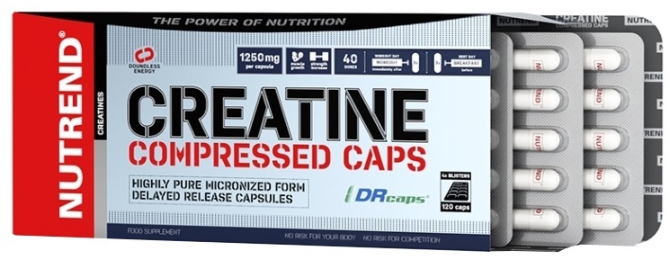 Nutrend Creatine Compressed Capsules in a blue and silver box, featuring 120 white capsules in a blister pack, highlighting 1250 mg per capsule and delayed release technology.