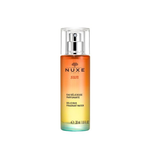 Clear glass bottle with a gradient from orange to yellow, featuring a silver spray nozzle and the NUXE logo prominently displayed on the front.
