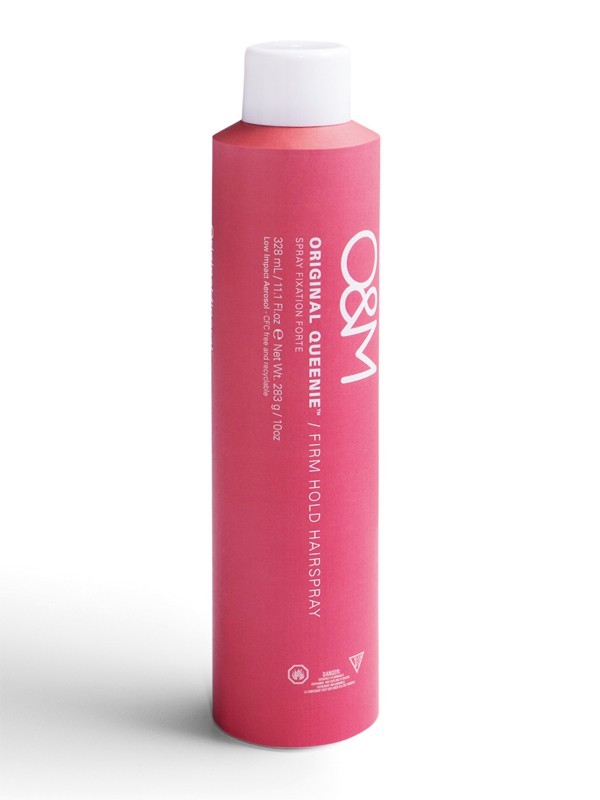 Pink cylindrical hairspray canister with a white cap, labeled "O & M Original Queenie Firm Hold Hairspray 300ml," highlighting flexible, long-lasting hold without flaking or stickiness.