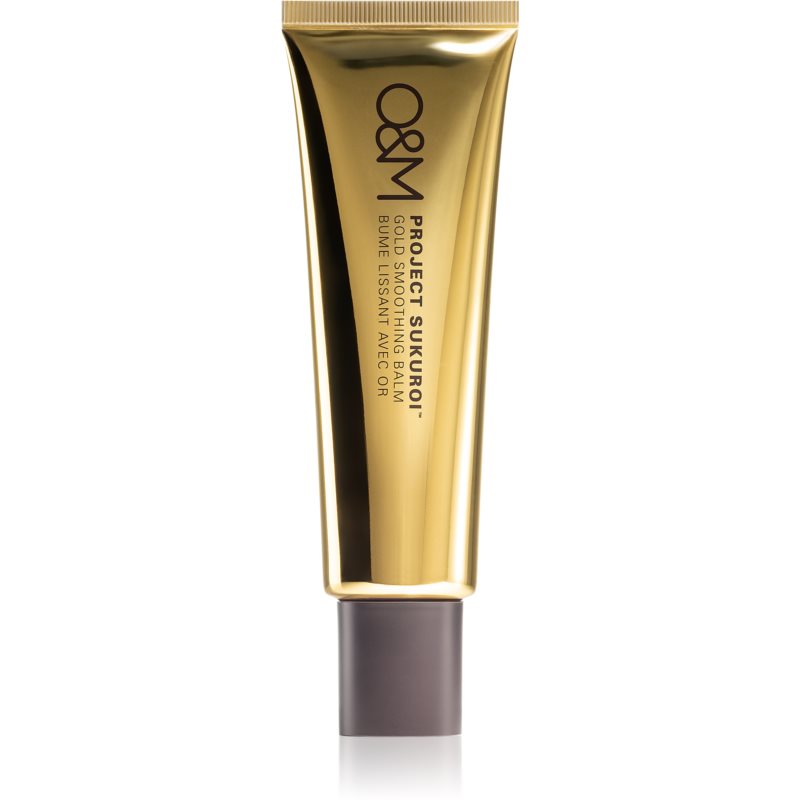 Gold and brown tube of O&M Project Sukuroi Smoothing Hair Balm, featuring a sleek design with a gold cap and a matte brown base, ideal for taming frizz and smoothing hair.