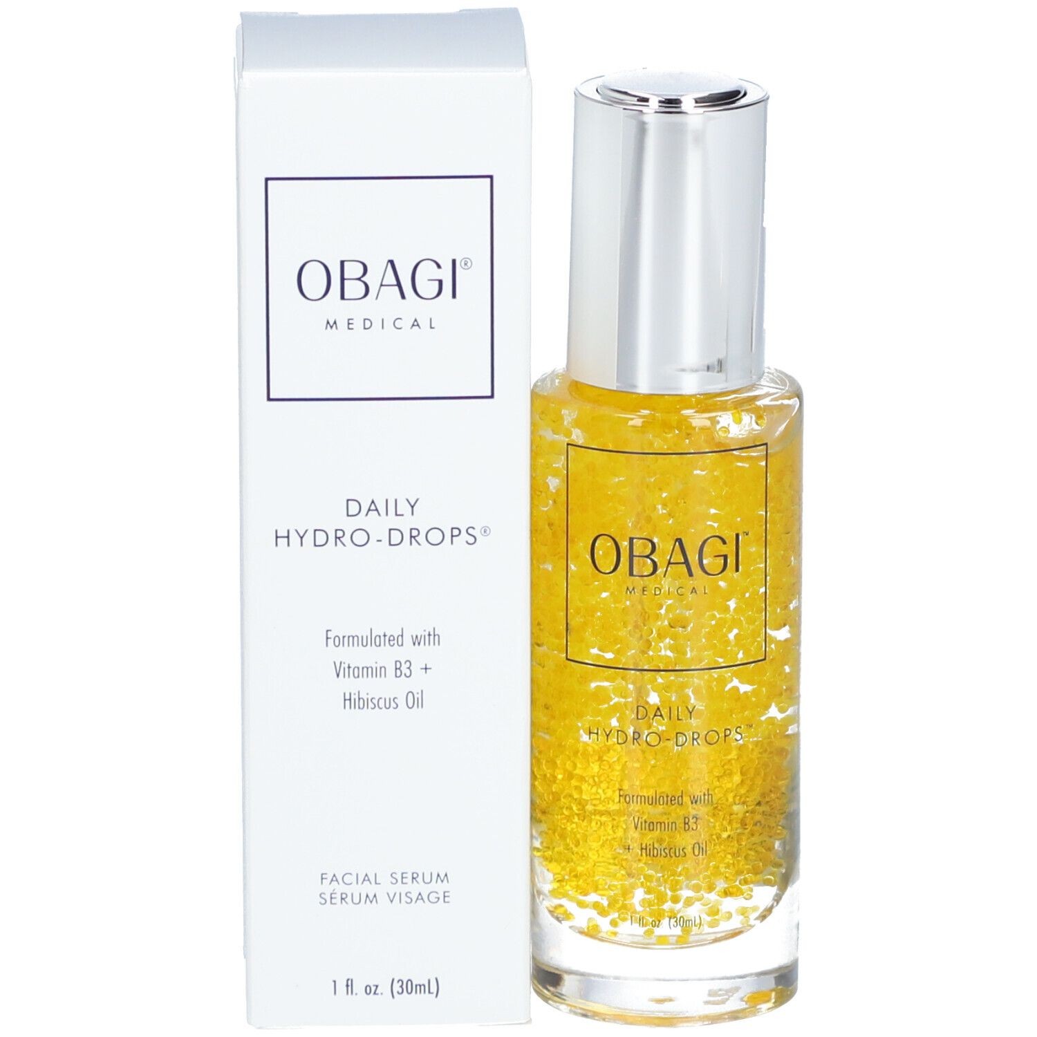 Clear glass bottle with a silver cap, containing a golden yellow serum with floating white particles, beside a white box labeled "OBAGI DAILY HYDRO-DROPS®" in bold black text.