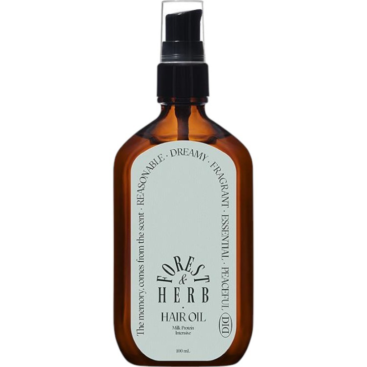 Amber glass bottle with a black spray top, labeled "Forest & Herb Hair Oil," featuring a calming design and text in white, highlighting its milk protein and intensive care properties.