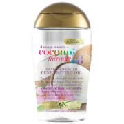 Clear bottle of Ogx Coconut Miracle Oil, featuring a gold cap, with colorful text highlighting "Extra Strength" and "Penetrating Hair Oil" for dry hair, 100 ml size.