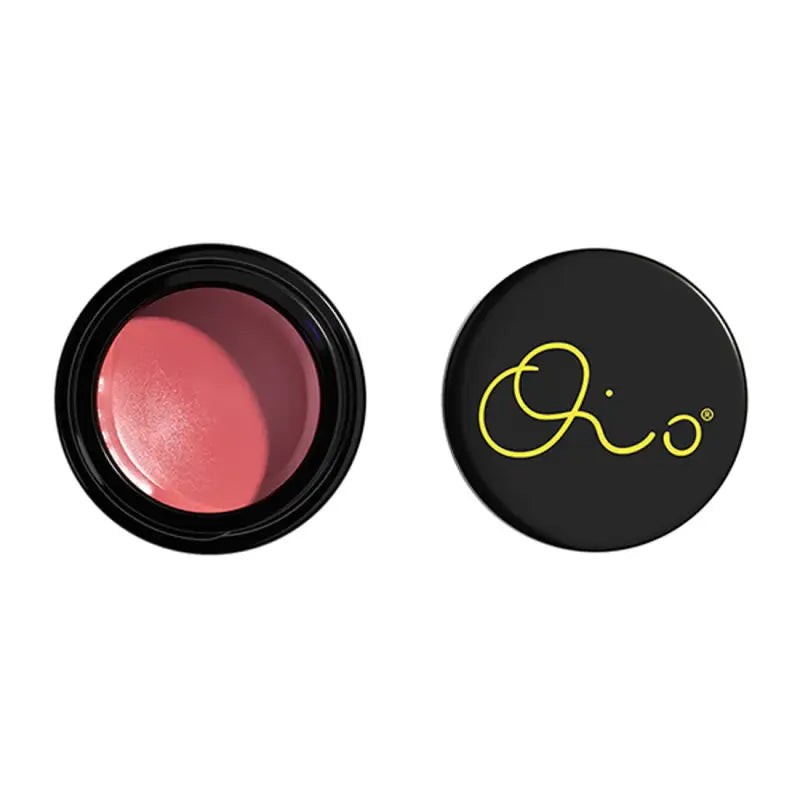 Oio Lab MELTING BLUSH Eye and Cheek Colour Balm in FUTURE GLOW, featuring a creamy, soft pink hue in a sleek black container with a yellow logo.