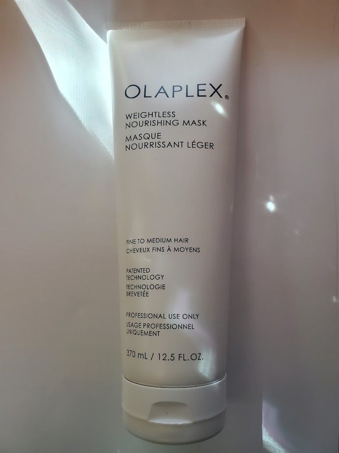 Olaplex Weightless Nourishing Mask in a sleek white tube, 12.5 oz, featuring black text and a minimalist design, suitable for fine to medium hair.