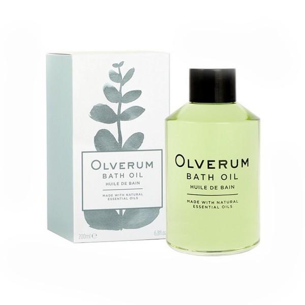 Green glass bottle of Olverum Bath Oil (250ml) with a minimalist label, alongside a matching light-colored box featuring a botanical illustration.