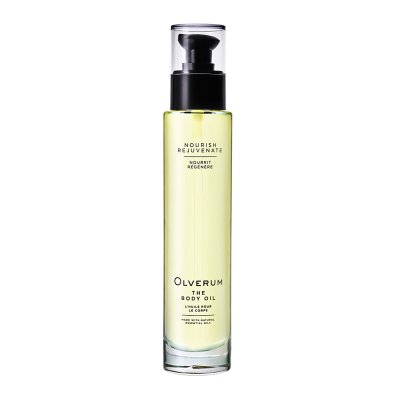 Transparent glass bottle with a black pump top, containing light yellow body oil, labeled "OLVERUM Dry Body Oil 100ml" with white text on a minimalist design.