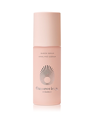 Light pink bottle with a sleek design, featuring a white cap and a sunburst logo, labeled "Omorovicza Queen Serum 30ml" in elegant black font.