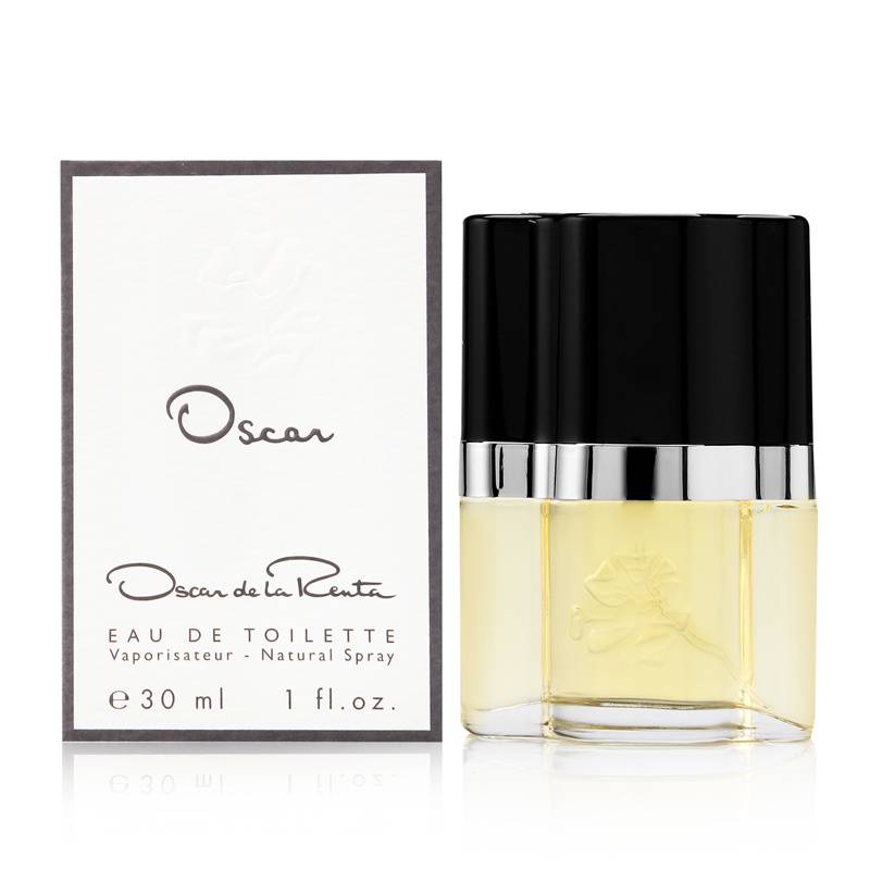 Clear glass bottle with a black cap, containing light yellow perfume, accompanied by a white box featuring the brand name "Oscar de la Renta" in elegant black lettering.