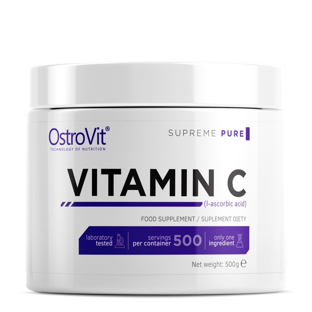 White container with a purple and black label, featuring "VITAMIN C" in bold letters, indicating a 500g food supplement of pure L-ascorbic acid by OstroVit.