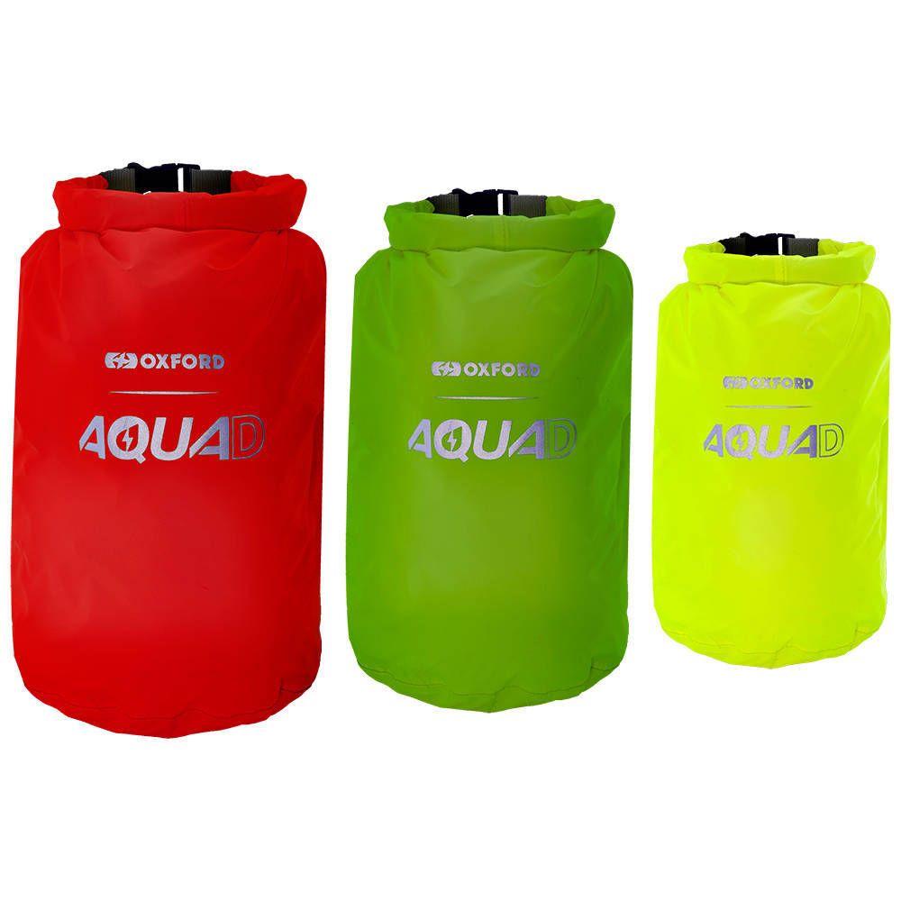 Three waterproof packing cubes in vibrant red, green, and bright yellow, featuring the "Aqua D" logo, made from durable material with roll-top closures.