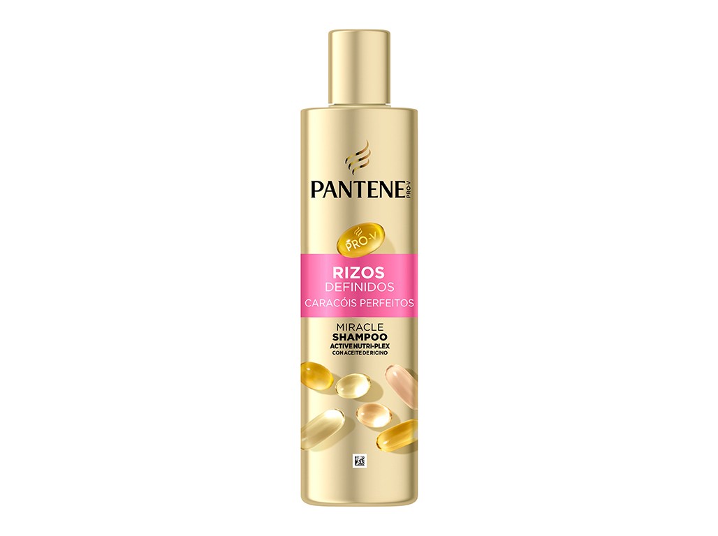 Gold and pink bottle of Pantene Miracle Shampoo for defined curls, featuring a sleek design with a pump top and colorful capsules depicted on the front.