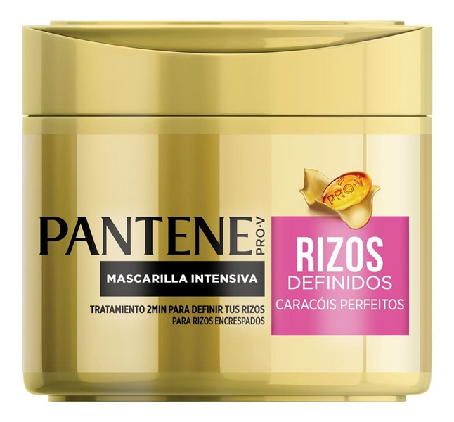 Gold-colored jar with a pink label, labeled "Pantene Pro-V Rizos Definidos," containing intensive hair treatment for defined curls.