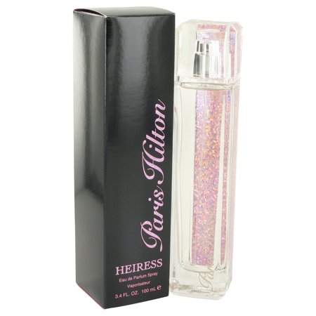 Clear glass perfume bottle filled with shimmering pink liquid, featuring a sparkly pink cap, alongside a sleek black box with pink text reading "Heiress" and "Paris Hilton."