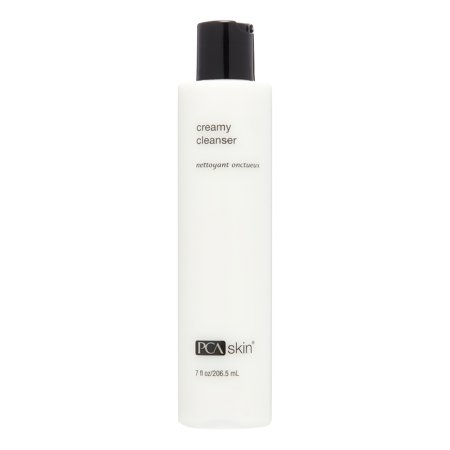 Tall, white plastic bottle with a black pump cap, labeled "creamy cleanser" and "PCA skin," containing 7 oz. of a creamy facial cleanser.