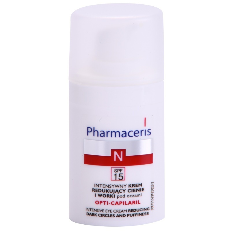 White cylindrical bottle of Pharmaceris N Opti-Capilaril 15ml with a pump dispenser, featuring red and blue branding and SPF 15 label.
